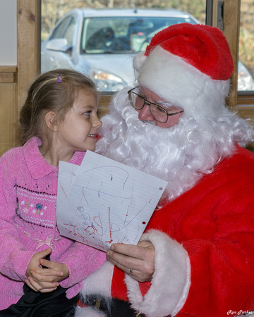SHE IS TRYING TO SWEET TALK SANTA INTO FILLING THE WHOLE LIST!