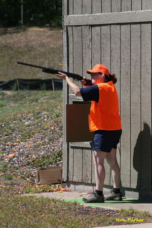 Instructor demonstrates firing a shotgun.